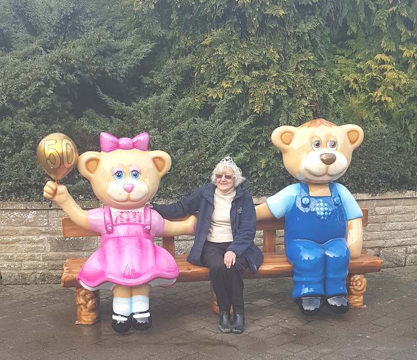 Mrs Rhodes on the 50th bench at sundown adventureland